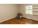 Bedroom with hardwood flooring, natural light, and closet at 6813 W Lake Anne Dr, Raleigh, NC 27612