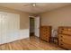 Bedroom features laminate floors, a ceiling fan, closet, and dresser at 6813 W Lake Anne Dr, Raleigh, NC 27612