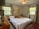 Comfortable bedroom with large windows and natural light at 700 Sawmill Rd, Raleigh, NC 27615