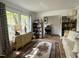 Cozy living room featuring a large window, comfortable seating, and stylish decor at 700 Sawmill Rd, Raleigh, NC 27615
