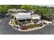 An aerial view of an outdoor restaurant, showcasing ample outdoor seating with lush greenery at 700 Sawmill Rd, Raleigh, NC 27615