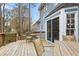 Spacious deck with stairs offers a serene outdoor area for dining and relaxation at 7112 Benhart Dr, Raleigh, NC 27613