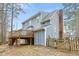 Exterior view of home with deck and fenced-in backyard, perfect for outdoor gatherings at 7112 Benhart Dr, Raleigh, NC 27613