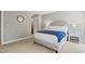 Bright bedroom with neutral walls, plush carpeting, and stylish furnishings at 7112 Benhart Dr, Raleigh, NC 27613
