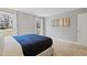 Bedroom featuring large windows, gray walls and carpet, complemented by tasteful artwork at 7112 Benhart Dr, Raleigh, NC 27613