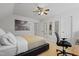 Bedroom featuring a modern workspace, neutral tones, and decorative wall art at 7112 Benhart Dr, Raleigh, NC 27613