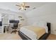 Cozy bedroom with sloped ceiling, desk with computer monitors, and ceiling fan at 7112 Benhart Dr, Raleigh, NC 27613