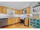 This is a kitchen with granite countertops, stainless steel appliances, and a stainless steel dishwasher at 7112 Benhart Dr, Raleigh, NC 27613