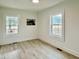 Bright bedroom with ample natural light and neutral walls at 808 E Hanover Rd, Graham, NC 27253