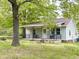 Charming home with a covered porch and mature shade tree at 808 E Hanover Rd, Graham, NC 27253