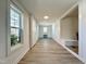 Long hallway with modern flooring and ample natural light at 808 E Hanover Rd, Graham, NC 27253