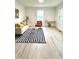 Bright living room features modern decor and light wood flooring at 808 E Hanover Rd, Graham, NC 27253