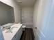 Bathroom featuring a vanity, toilet, and shower-tub combination with tiled walls at 817 Kenyon Springs Dr, Zebulon, NC 27597