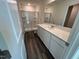 Modern bathroom featuring a single sink vanity and walk-in shower with sleek glass doors at 817 Kenyon Springs Dr, Zebulon, NC 27597