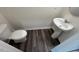 Efficient half-bathroom with a modern sink and faucet on stylish vinyl flooring at 817 Kenyon Springs Dr, Zebulon, NC 27597