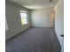 Bedroom with neutral carpet, natural light, and ample space for furniture arrangement at 817 Kenyon Springs Dr, Zebulon, NC 27597