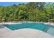 Enjoy the community pool with an area for lap swimming, surrounded by trees at 817 Kenyon Springs Dr, Zebulon, NC 27597