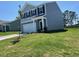 Attractive two-story home with gray siding, well-maintained landscaping, and attached garage at 817 Kenyon Springs Dr, Zebulon, NC 27597