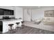Open-concept living area showcasing the kitchen and living room with ample natural light at 817 Kenyon Springs Dr, Zebulon, NC 27597
