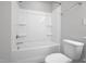 Bathroom featuring a shower/bathtub combo with silver hardware and a white toilet at 82 White Ash Dr, Clayton, NC 27527