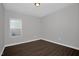 Bright bedroom with neutral paint, hard wood floors, and natural lighting at 82 White Ash Dr, Clayton, NC 27527
