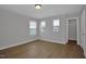 Bright bedroom with wood-look floors and multiple windows at 82 White Ash Dr, Clayton, NC 27527