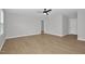 Large bedroom featuring wood-look flooring, neutral walls, and a ceiling fan at 82 White Ash Dr, Clayton, NC 27527