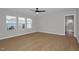Spacious bedroom with wood-look flooring, neutral walls, and lots of natural light at 82 White Ash Dr, Clayton, NC 27527
