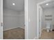 Walk-in closet beside a bathroom at 82 White Ash Dr, Clayton, NC 27527