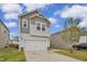 Beautiful two-story home featuring a two-car garage and neutral-colored siding in a Gathering-friendly neighborhood at 82 White Ash Dr, Clayton, NC 27527