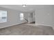 Spacious living room with neutral paint, carpet flooring, and bright, natural light at 82 White Ash Dr, Clayton, NC 27527