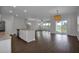 Open-concept living room showcasing recessed lighting and sliding glass doors to a back patio at 82 White Ash Dr, Clayton, NC 27527
