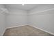 Walk-in closet with carpet and white wire shelving at 82 White Ash Dr, Clayton, NC 27527
