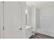Clean bathroom design featuring wood-look flooring and white fixtures, including a shower and vanity at 821 Kenyon Spring Dr, Zebulon, NC 27597