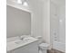 Bright bathroom features a sleek vanity with a white countertop and a shower-tub combination at 821 Kenyon Spring Dr, Zebulon, NC 27597