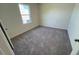 Bedroom with a window and neutral carpet at 821 Kenyon Spring Dr, Zebulon, NC 27597