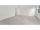 Cozy bedroom with carpeted floors and abundant natural light streaming through the window at 821 Kenyon Spring Dr, Zebulon, NC 27597