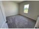 Bedroom with a window and neutral carpet at 821 Kenyon Spring Dr, Zebulon, NC 27597