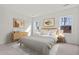 Serene bedroom with natural light, neutral decor, and stylish wooden furniture at 821 Kenyon Spring Dr, Zebulon, NC 27597