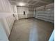 A large, unfinished two-car garage provides ample space for vehicles and storage at 821 Kenyon Spring Dr, Zebulon, NC 27597