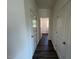 Hallway showcasing modern vinyl floors, leading to brightly lit rooms at 821 Kenyon Spring Dr, Zebulon, NC 27597