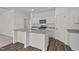 Modern kitchen featuring granite countertops, stainless steel appliances, and white cabinets at 821 Kenyon Spring Dr, Zebulon, NC 27597