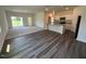 The open-concept living space includes sleek floors, abundant natural light, and a modern kitchen view at 821 Kenyon Spring Dr, Zebulon, NC 27597