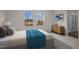 Comfortable bedroom with two windows providing ample light, complemented by stylish modern decor at 845 Kenyon Spring Dr, Zebulon, NC 27597