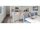 Modern kitchen with white cabinets, granite countertops, stainless steel appliances, and bar stool seating at 845 Kenyon Spring Dr, Zebulon, NC 27597