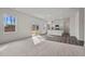 Bright living room flows into a modern kitchen and boasts access to the backyard at 845 Kenyon Spring Dr, Zebulon, NC 27597