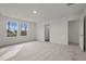 A spacious main bedroom with a neutral color palette and an ensuite bathroom at 845 Kenyon Spring Dr, Zebulon, NC 27597