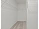 Spacious walk-in closet with shelving, providing ample storage space at 845 Kenyon Spring Dr, Zebulon, NC 27597