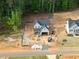 Aerial view of a home under construction in a new neighborhood, highlighting its setting near wooded areas at 85 Purslane Dr, Franklinton, NC 27525