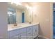 Bathroom with double sink vanity and a framed mirror at 85 Purslane Dr, Franklinton, NC 27525